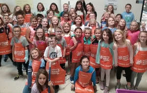 Arts and Craft Club Receives New Aprons from The Home Depot