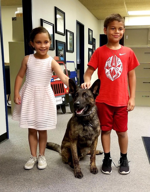 Ava and TJ with Middletown K-9 officer